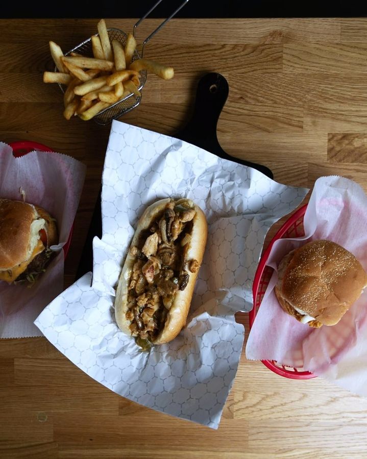 Burgers, a cheesesteak and fries from above