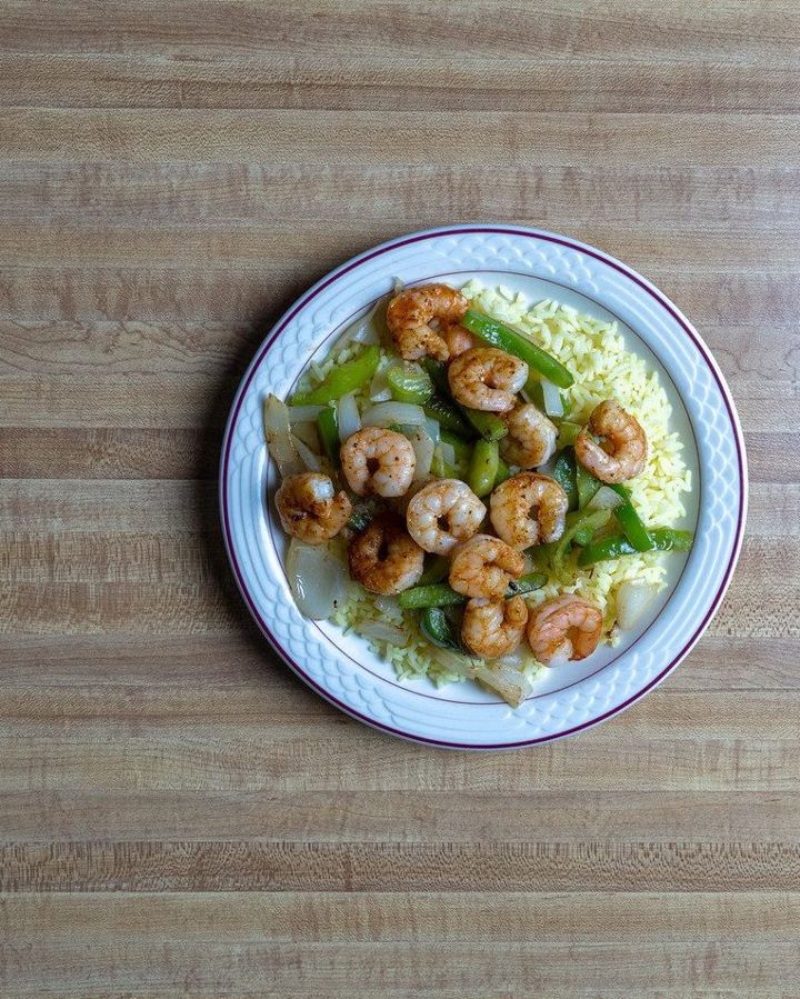 Shrimp and peppers over rice