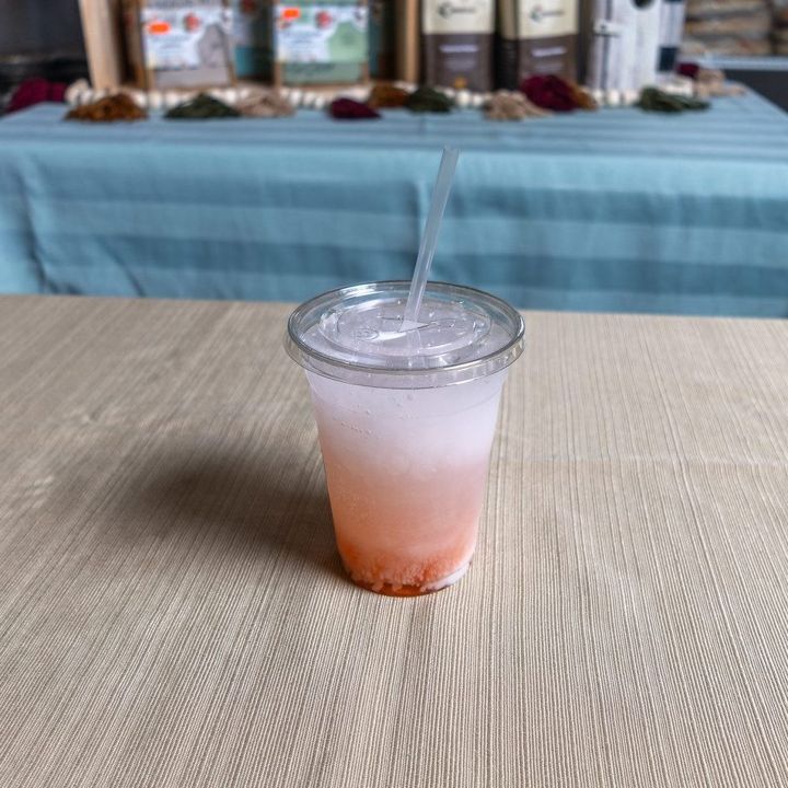 Iced pink lemonade with a straw