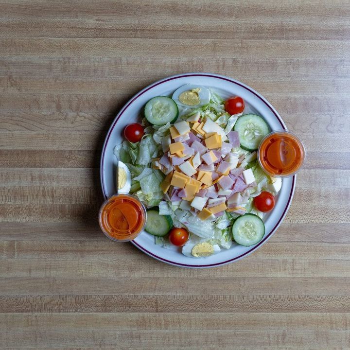 Garden salad with dressings, shot from above