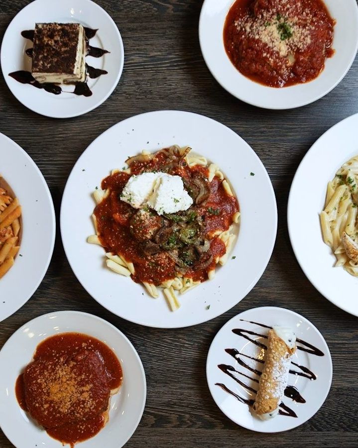 Overhead spread of Italian pasta dishes