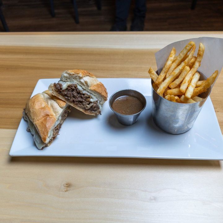 French dip sandwich with au jus and fries