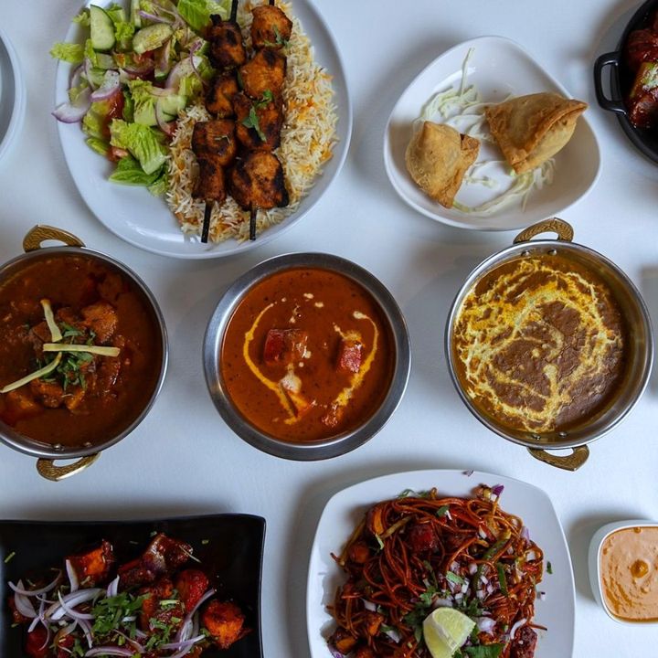 Overhead spread of Nepali and Indian dishes