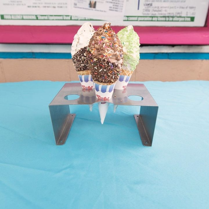 Dipped soft-serve cones in a cone stand